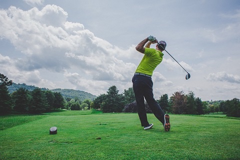 A man playing golf