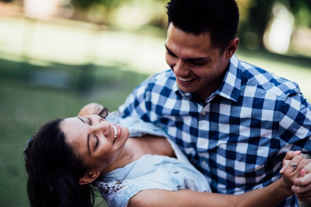 A young couple having fun while dancing.