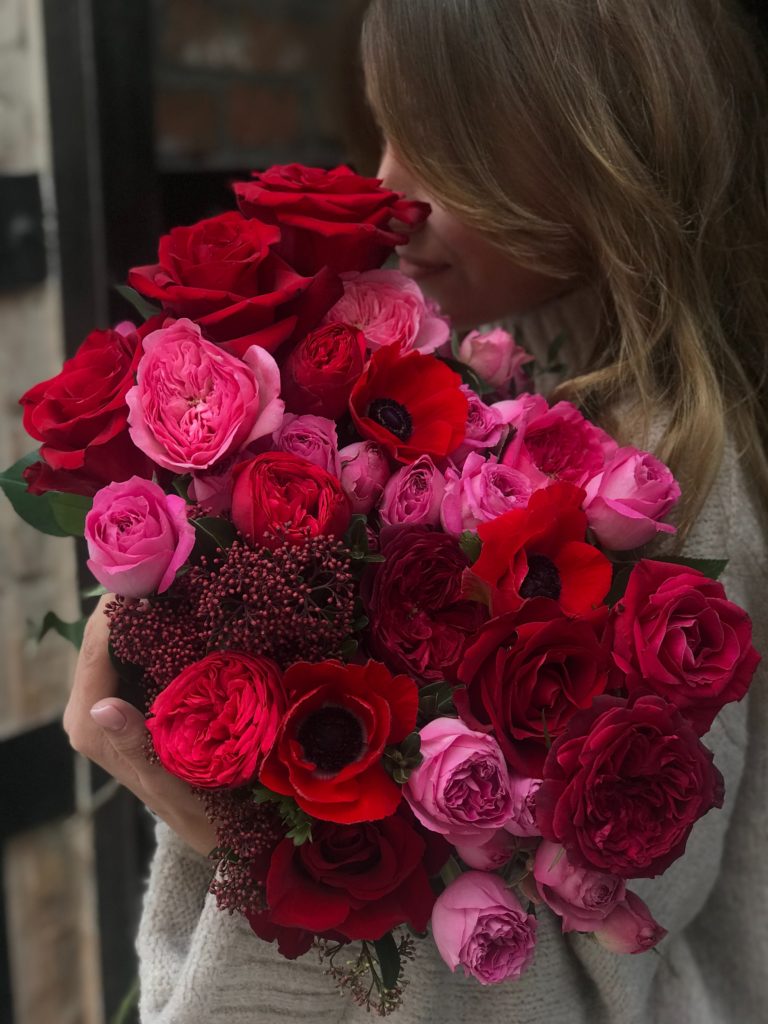 photo of Jennifer's Valentine's Day celebration: her with giant rose bouquet