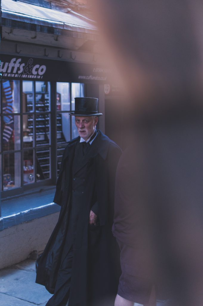 old man wearing a top hat on street, obviously not the first sugar daddy