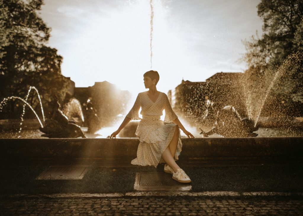 girl near fountain at one of the biggest fashion capital in the world, Paris