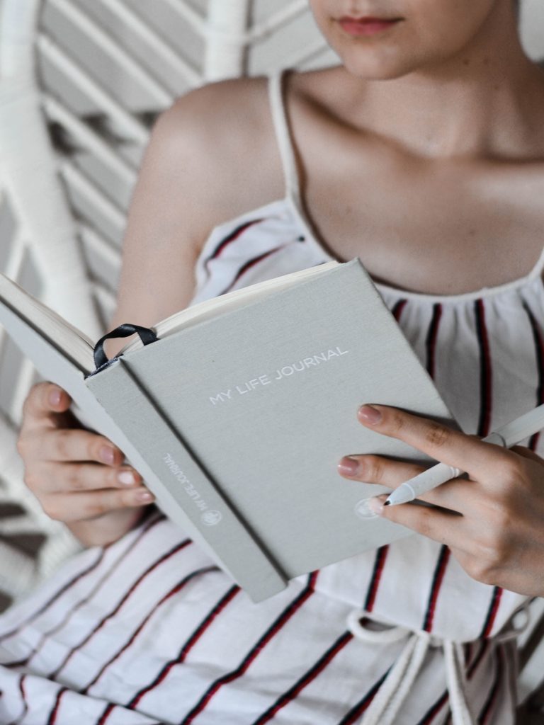 potentially sapiosexual girl writing in her journal