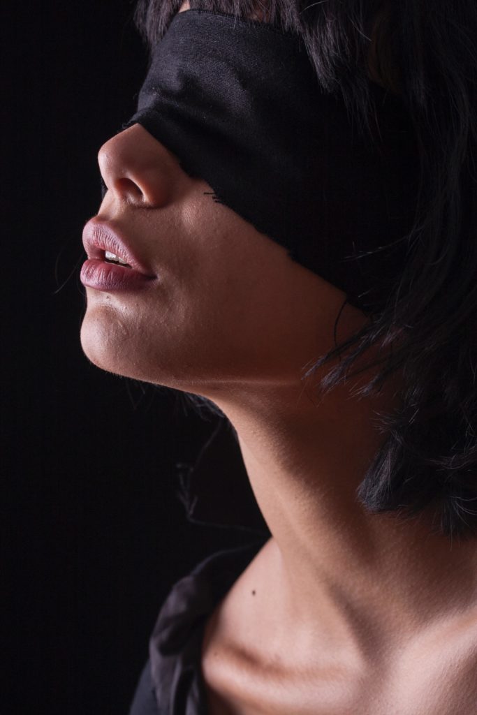 woman playing one of the most popular erotic games blindfolded