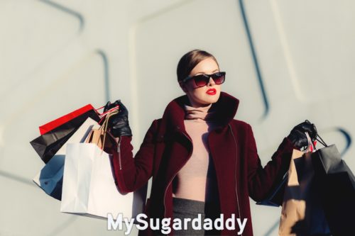 woman holding shopping bags she got by rinsing