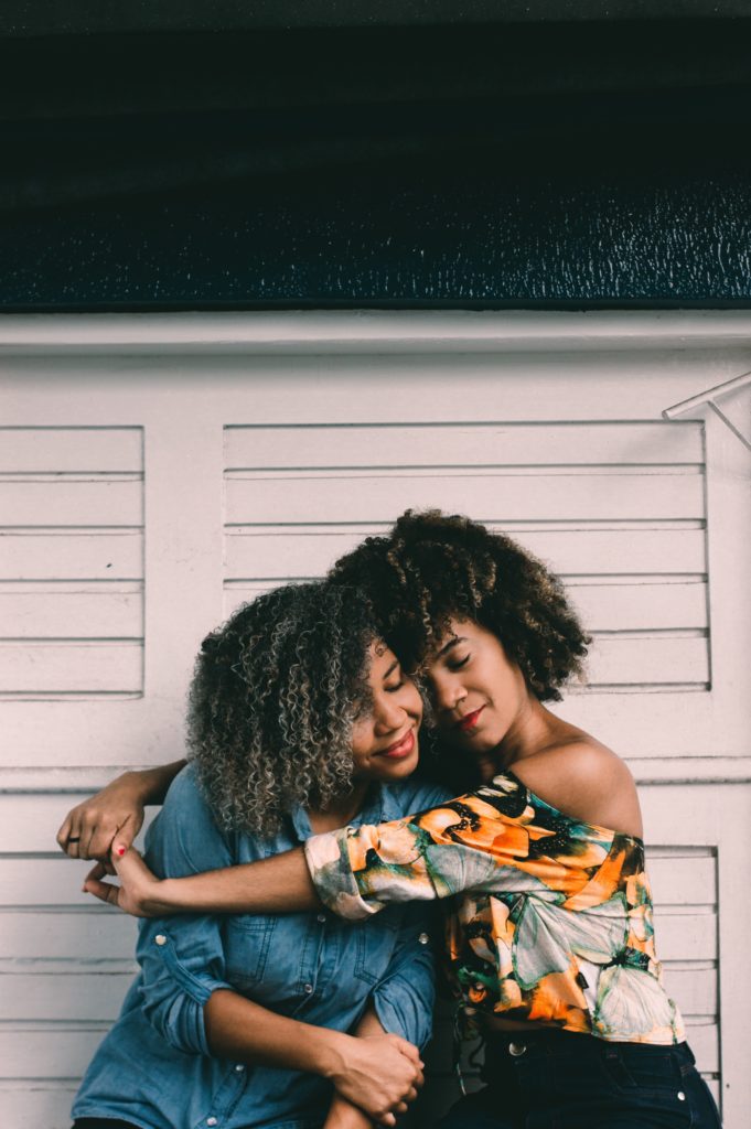 sisters hugging each other during quarantine time