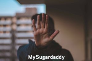 sugar daddy signaling a deal breaker with his hand