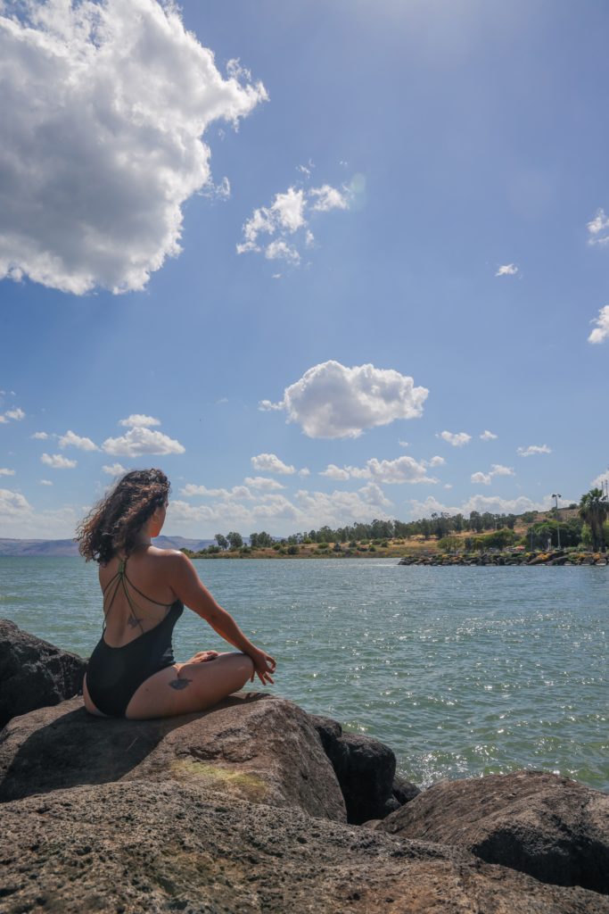 girl meditation at beach