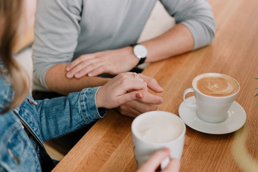 couple talking about commitment over coffee