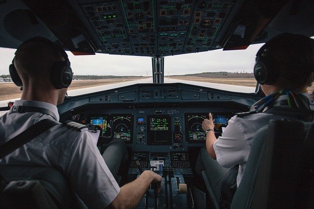 pilots in their cockpit representing one of the jobs where men cheat the most