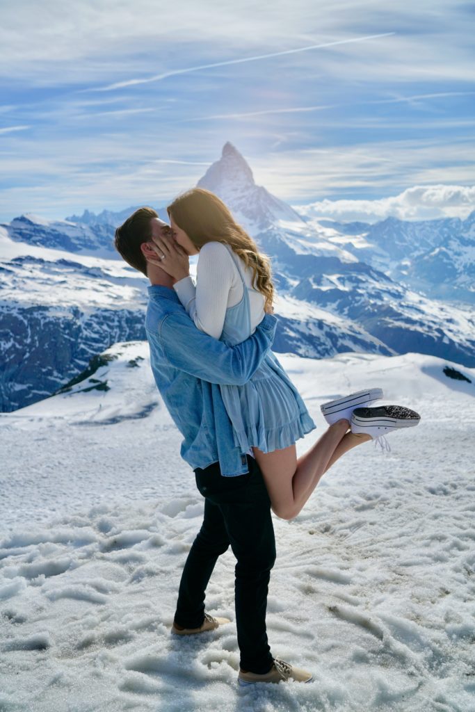 couple having fairy tale proposal on a mountain