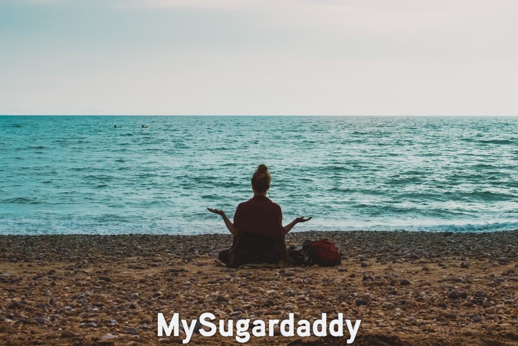 woman at beach expressing gratitude through her body language