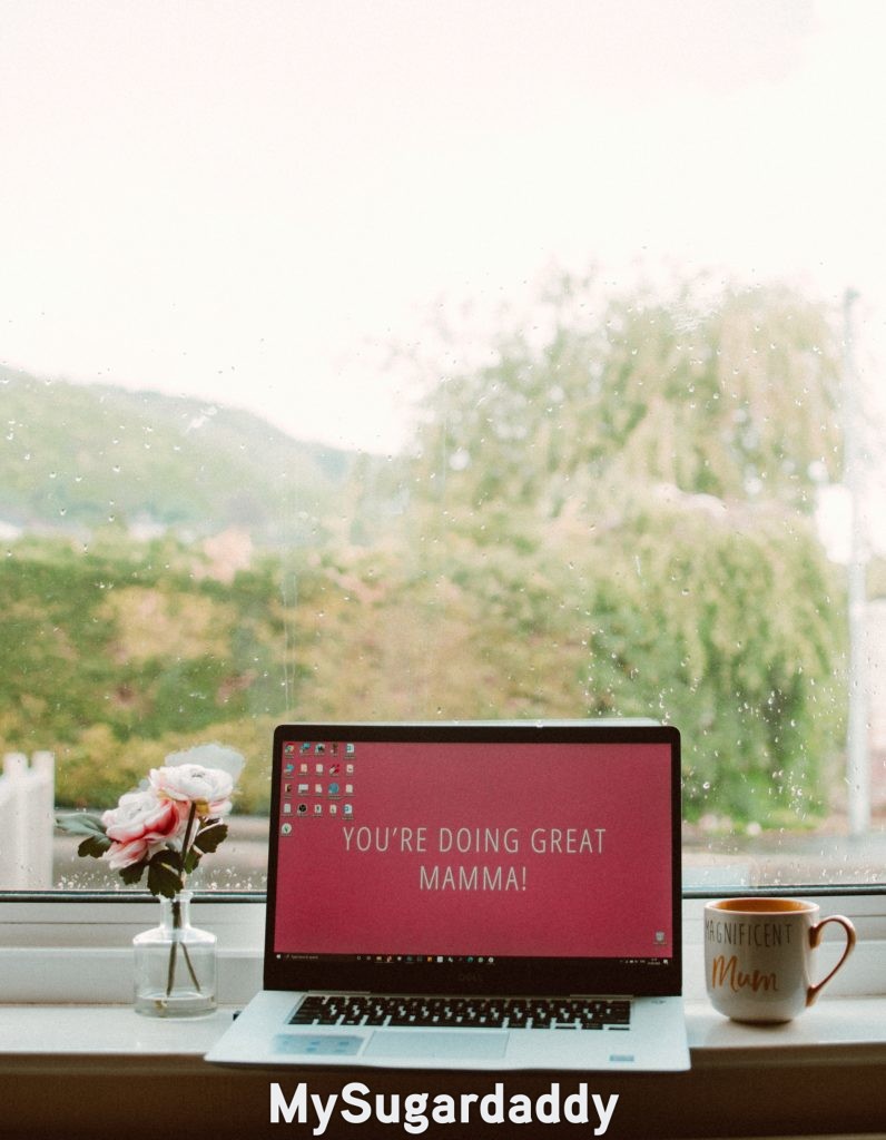 single mom sugar baby's laptop with message that reads "you are doing great, mom"